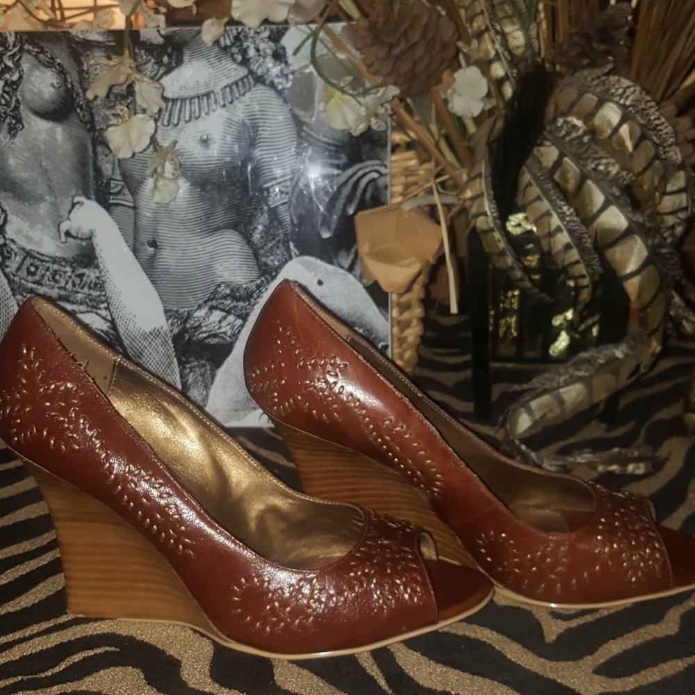 Gently used,  studded reddish brown wedges